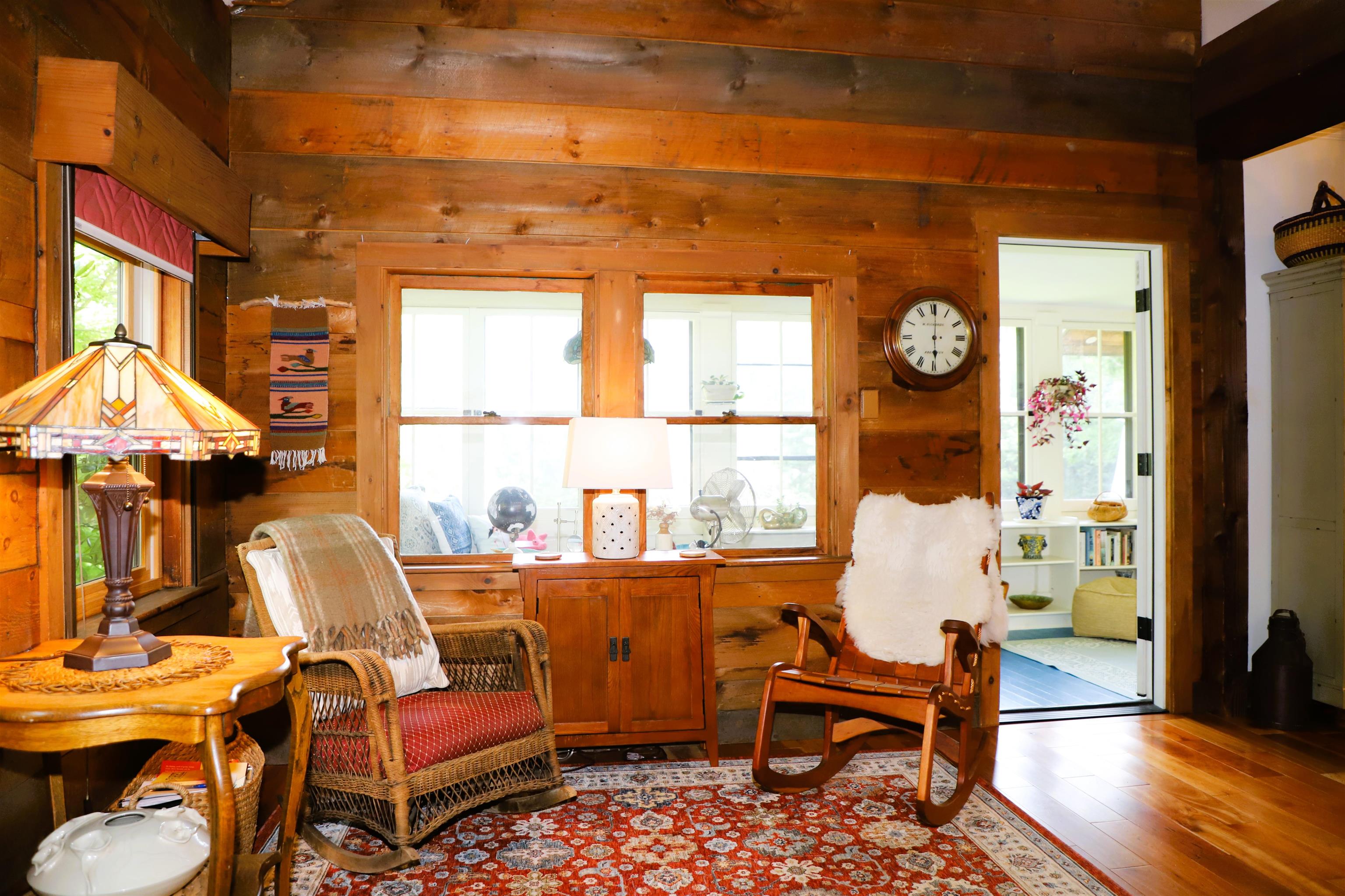 Living rooms opens to the enclosed porch