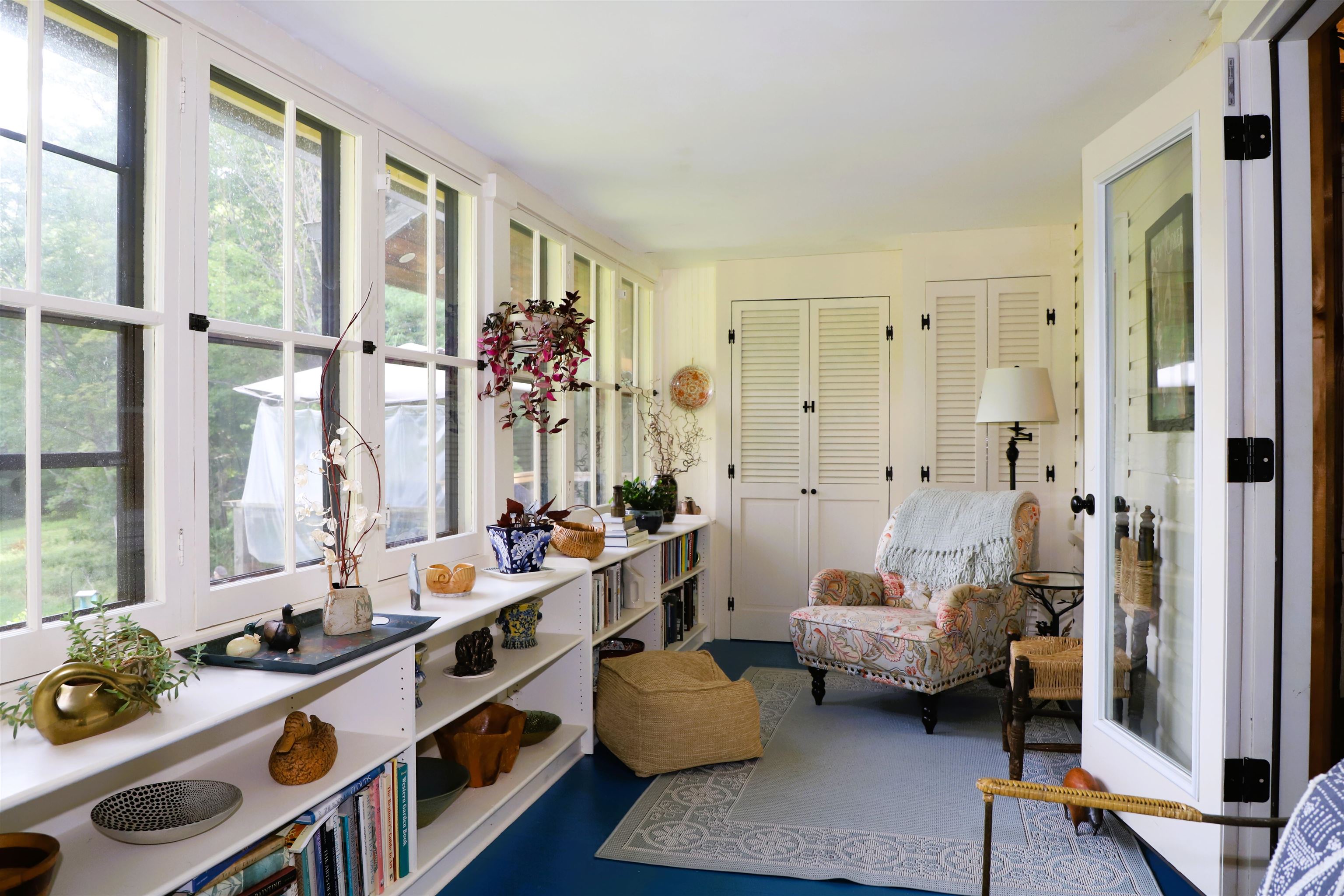 Enclosed porch begs you to sit and relax