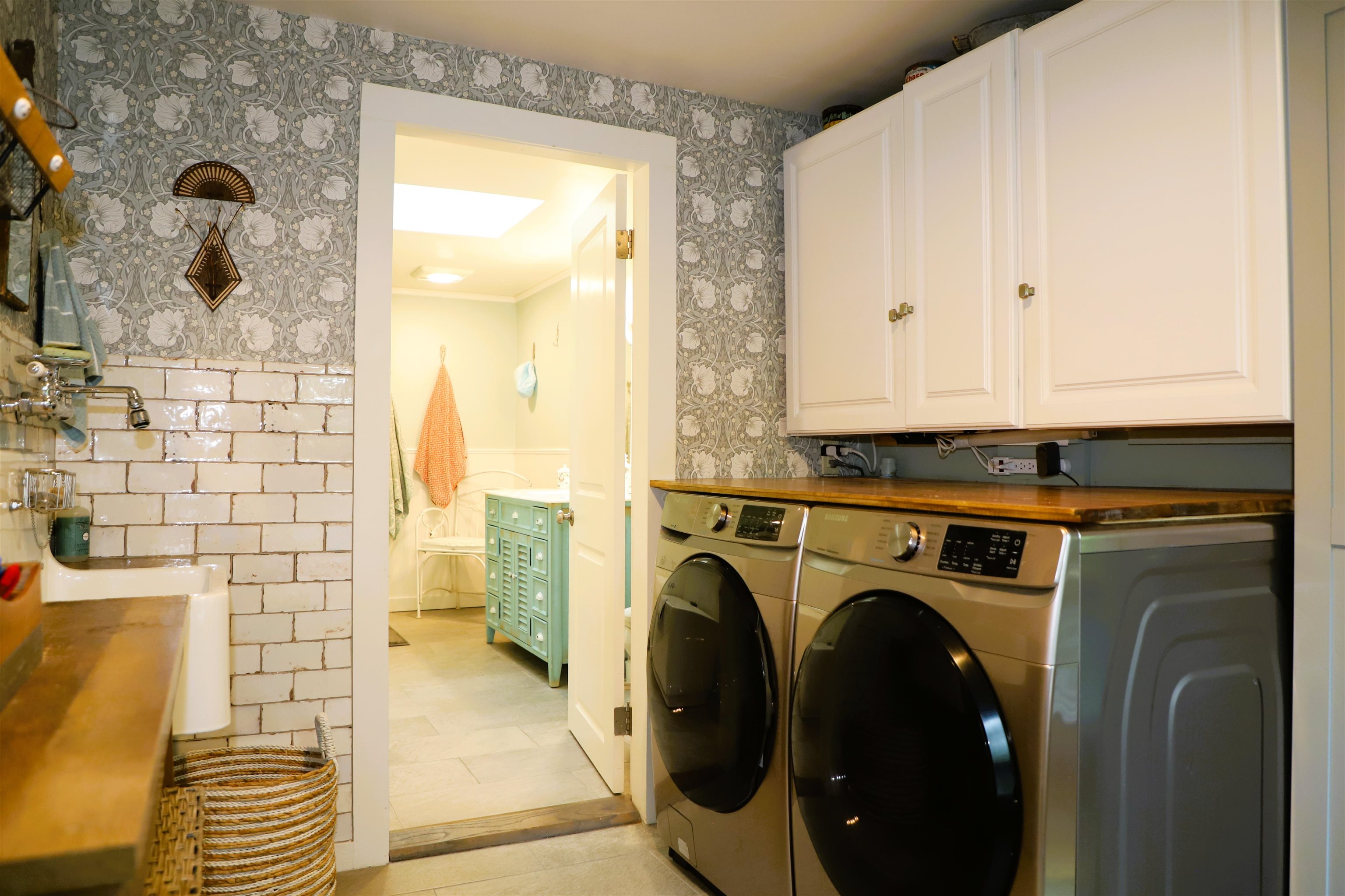 Main floor laundry and storage space off  the kitchen