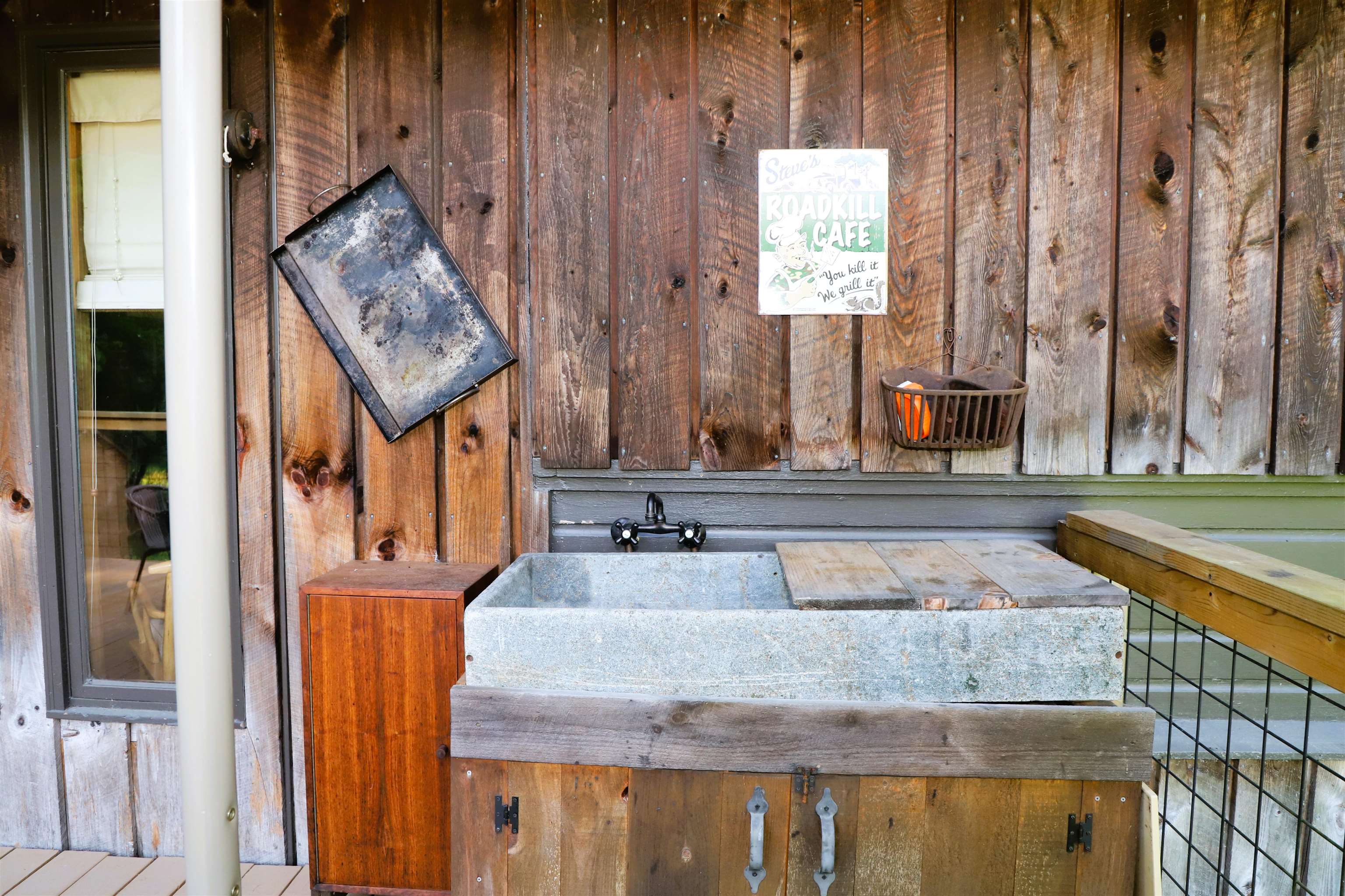 Reclaimed soapstone outdoor 3 season sink on deck