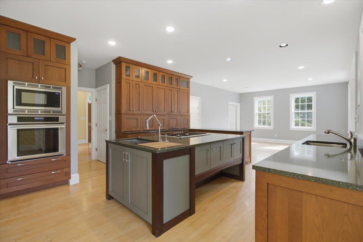 Custom Island features Stainless Sink and 5-burner gas cooktopstove top