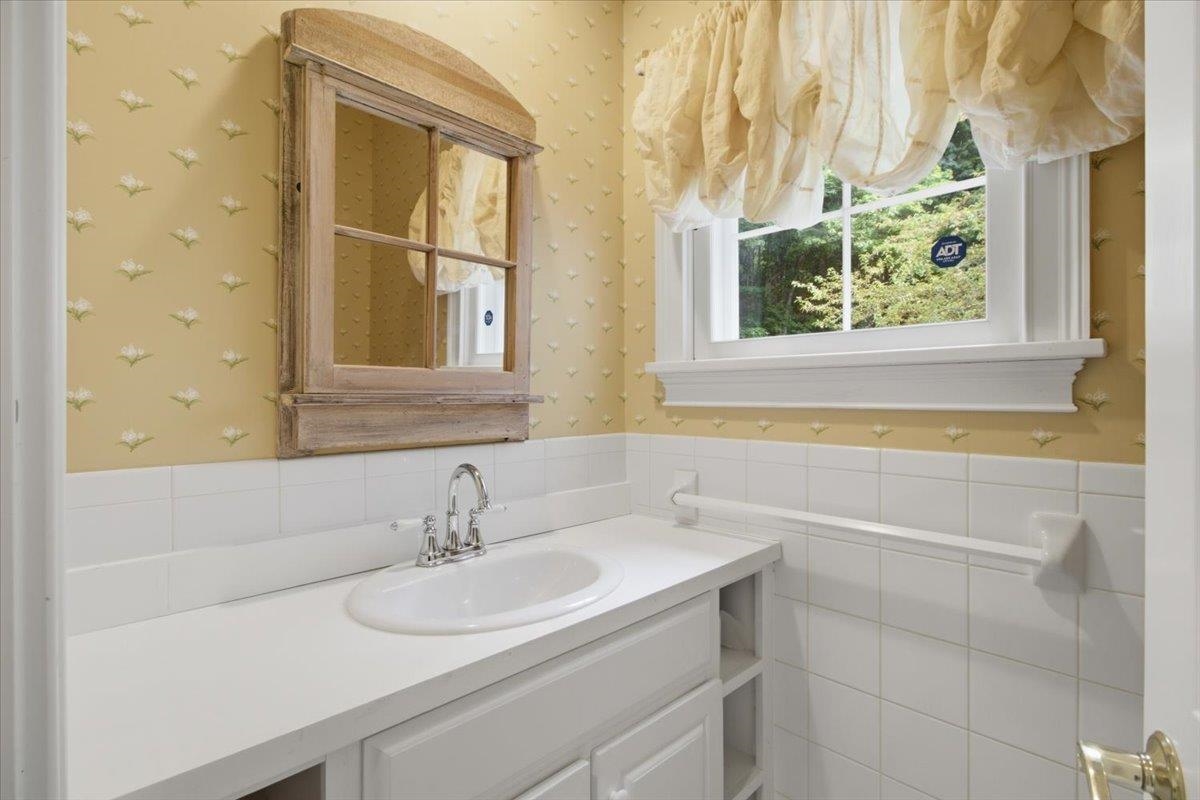 Powder Room - conveniently located near mud room/garage/side entrance