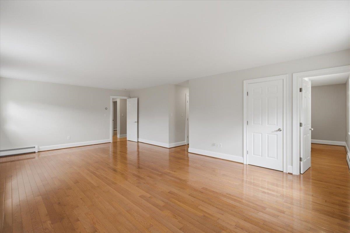 Primary Suite showing hallways to office, walk-in closet(s), bath,