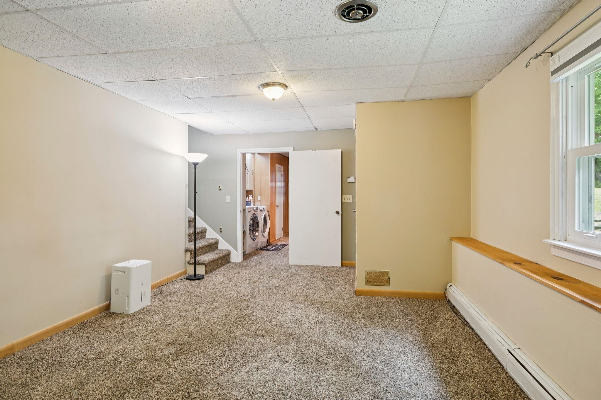 Den looking into laundry room