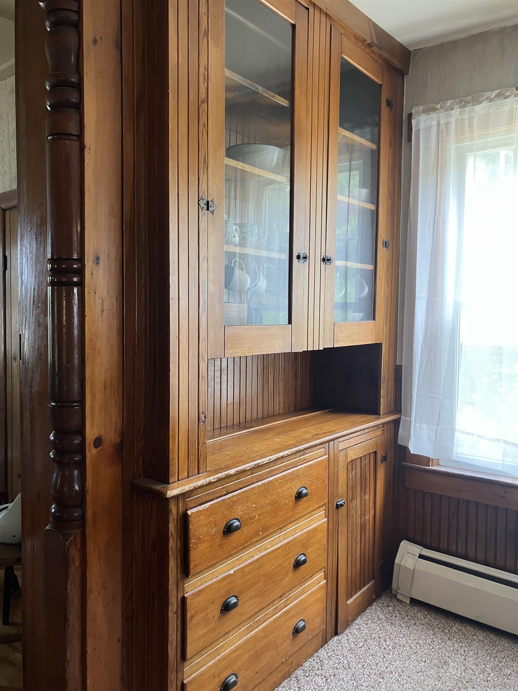 With beautiful honey toned built-in hutch