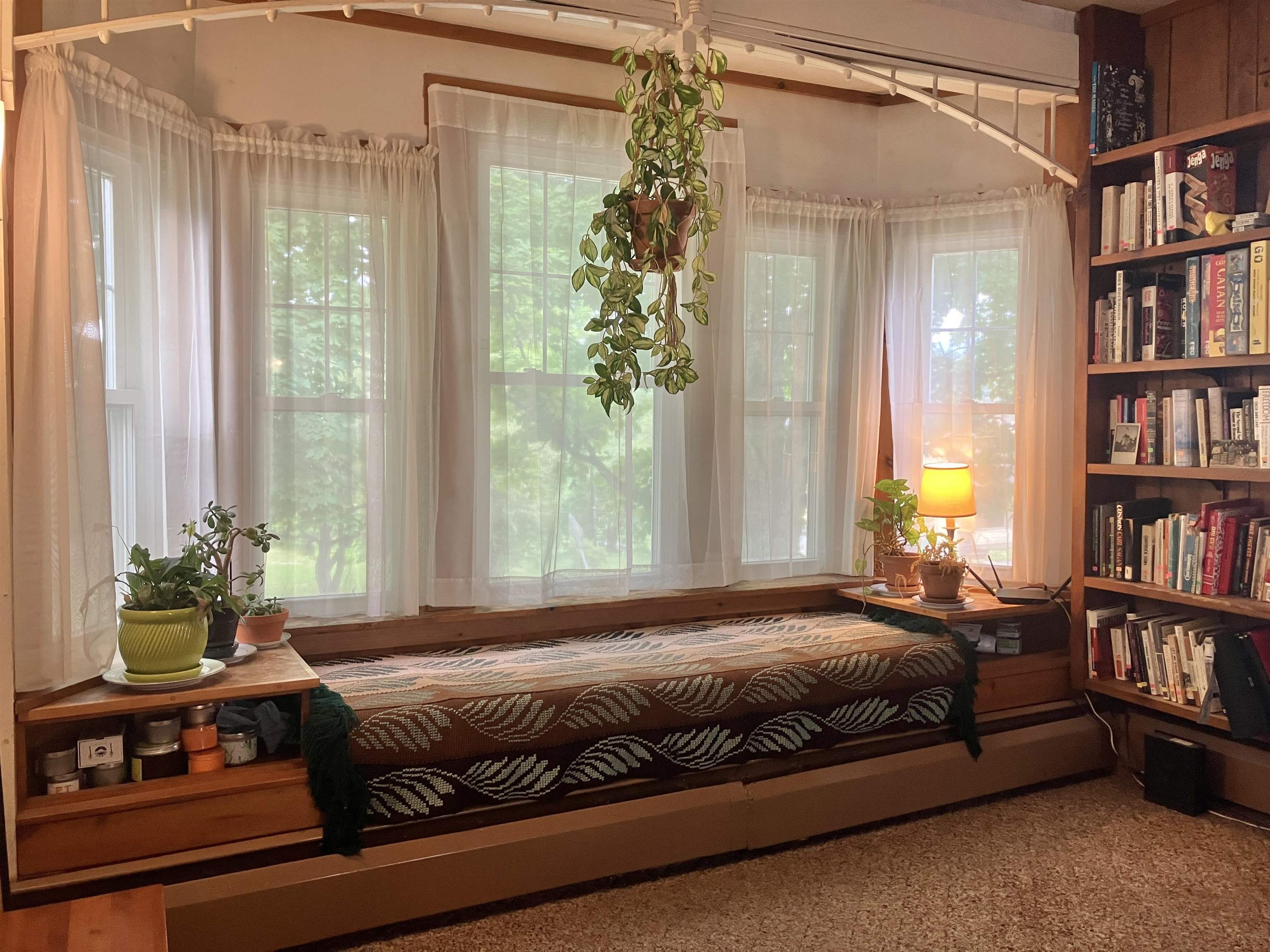 Bay window seating with built-in end tables! Plenty of room to stretch out and read...