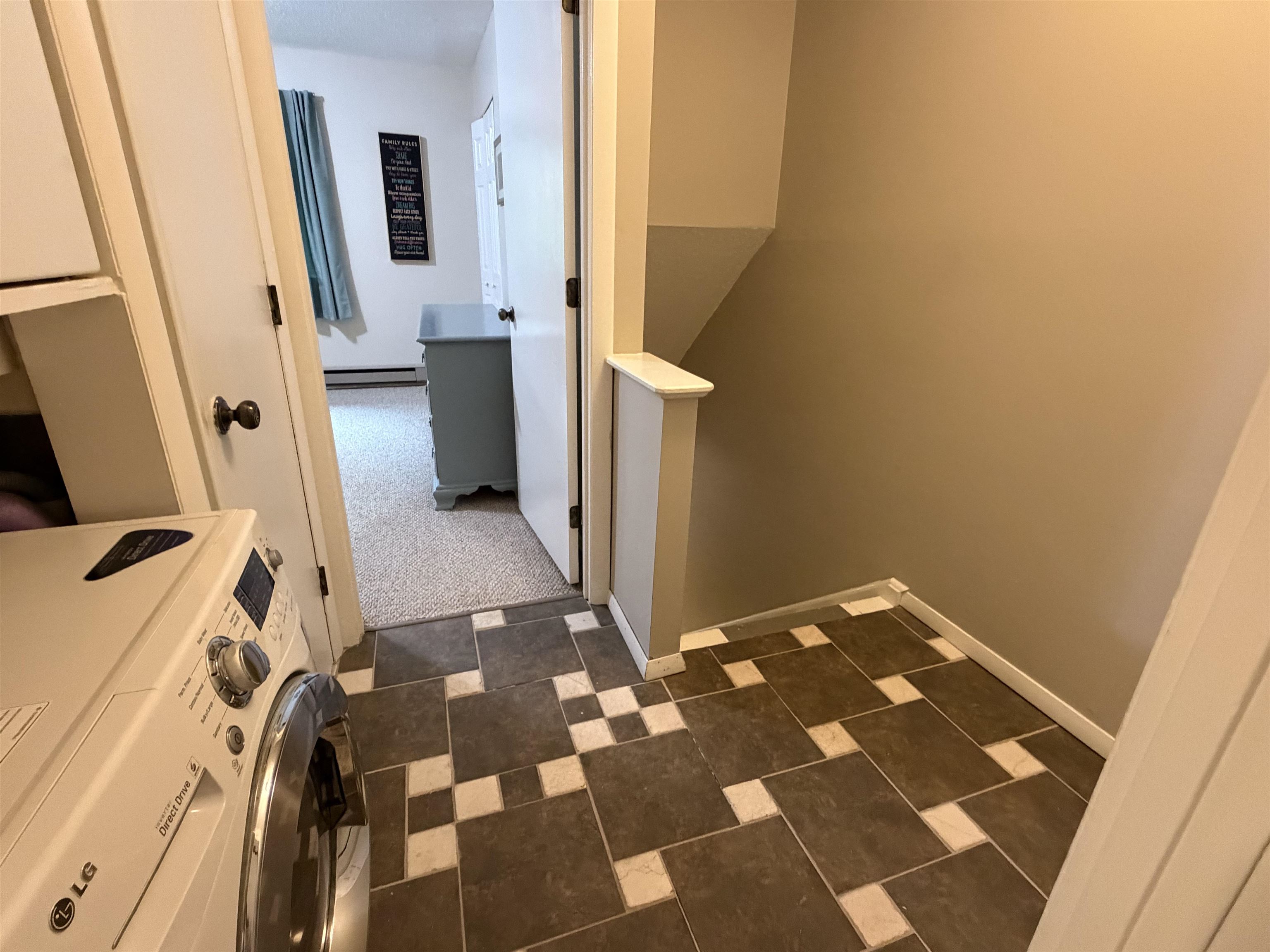 Tiled floor at the top of the stairs