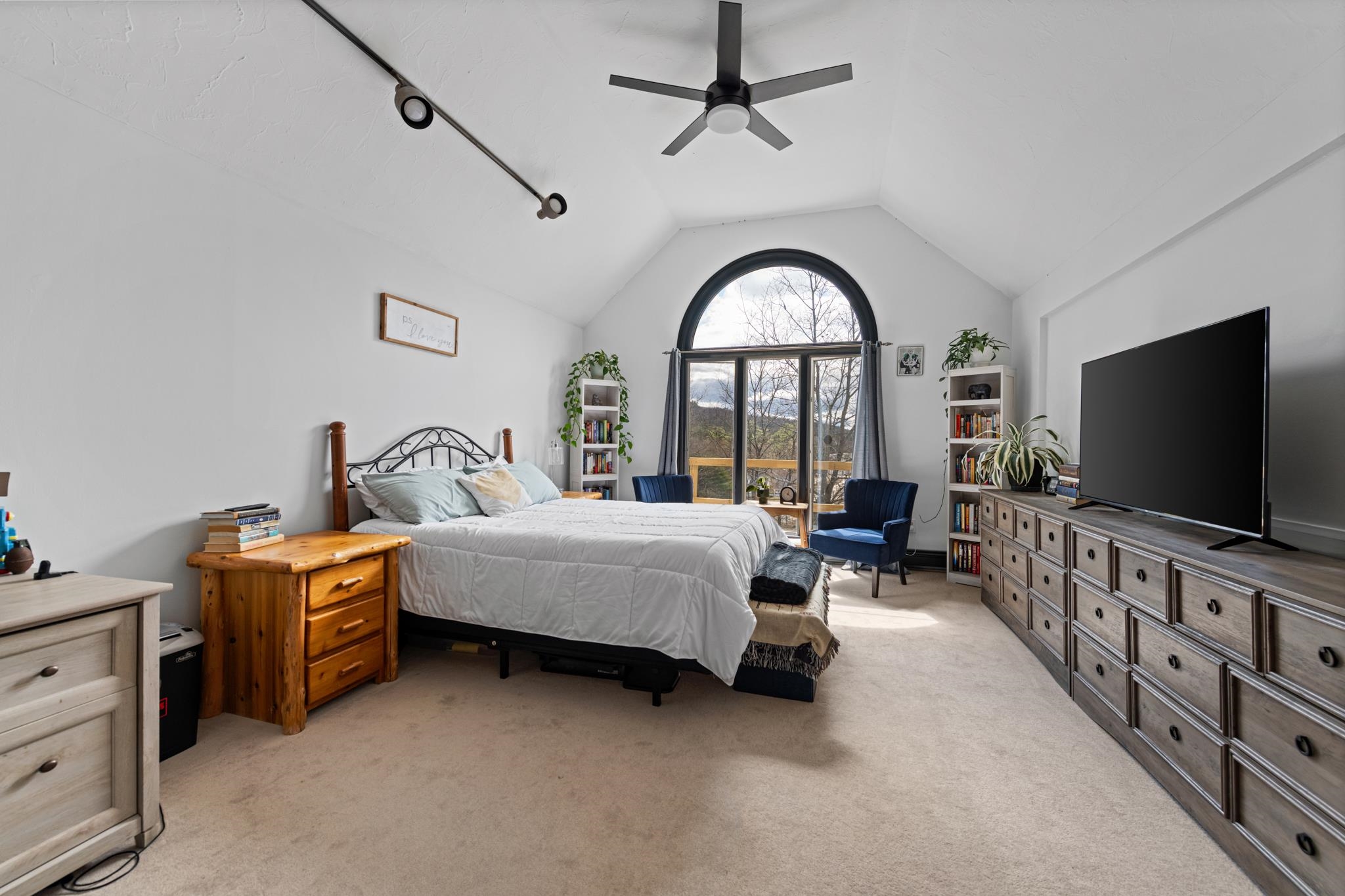 This 3rd bedroom/office on the 3rd level has tall ceilings and tons natural light