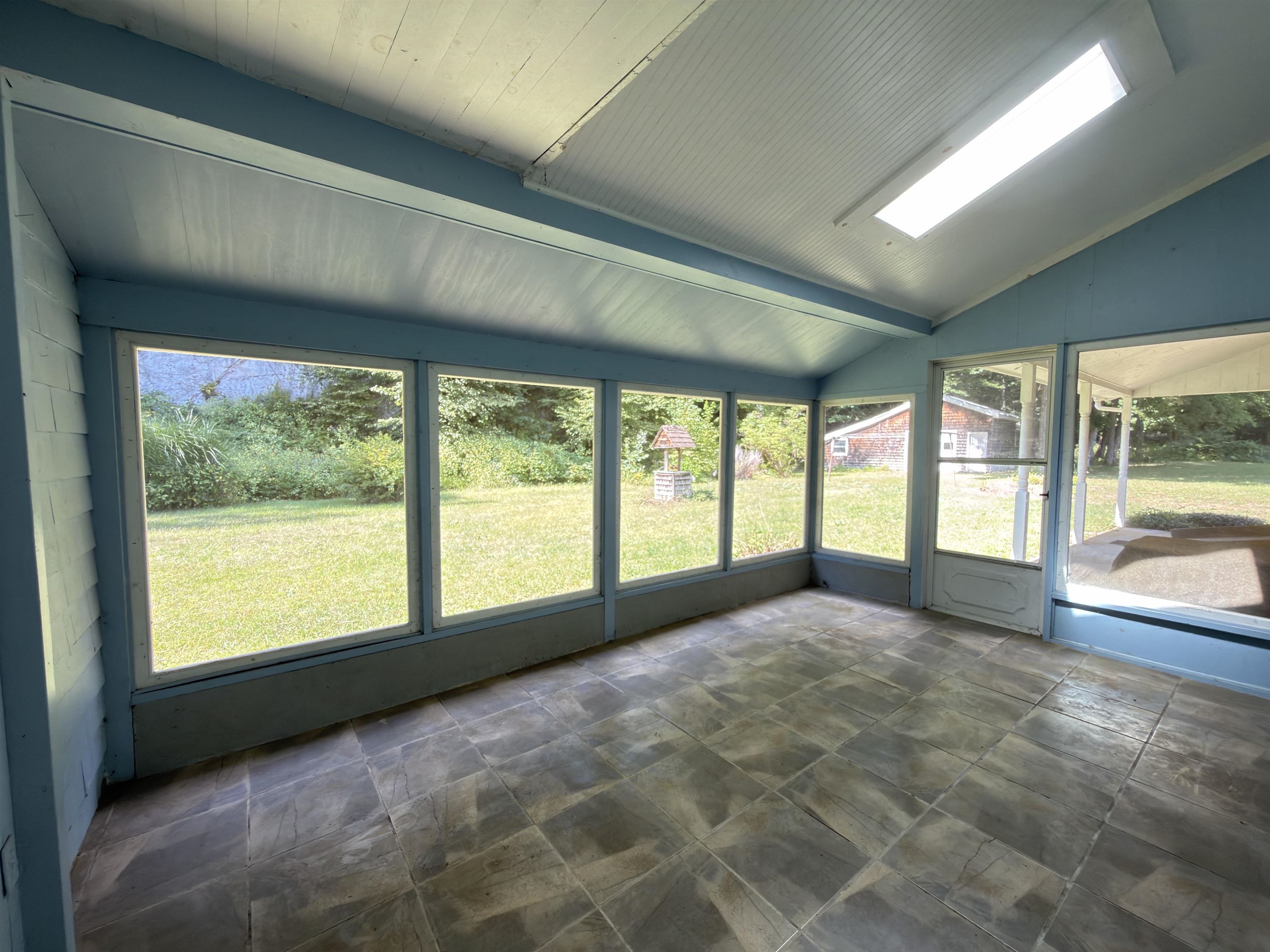 Enclosed porch overlooking backyard
