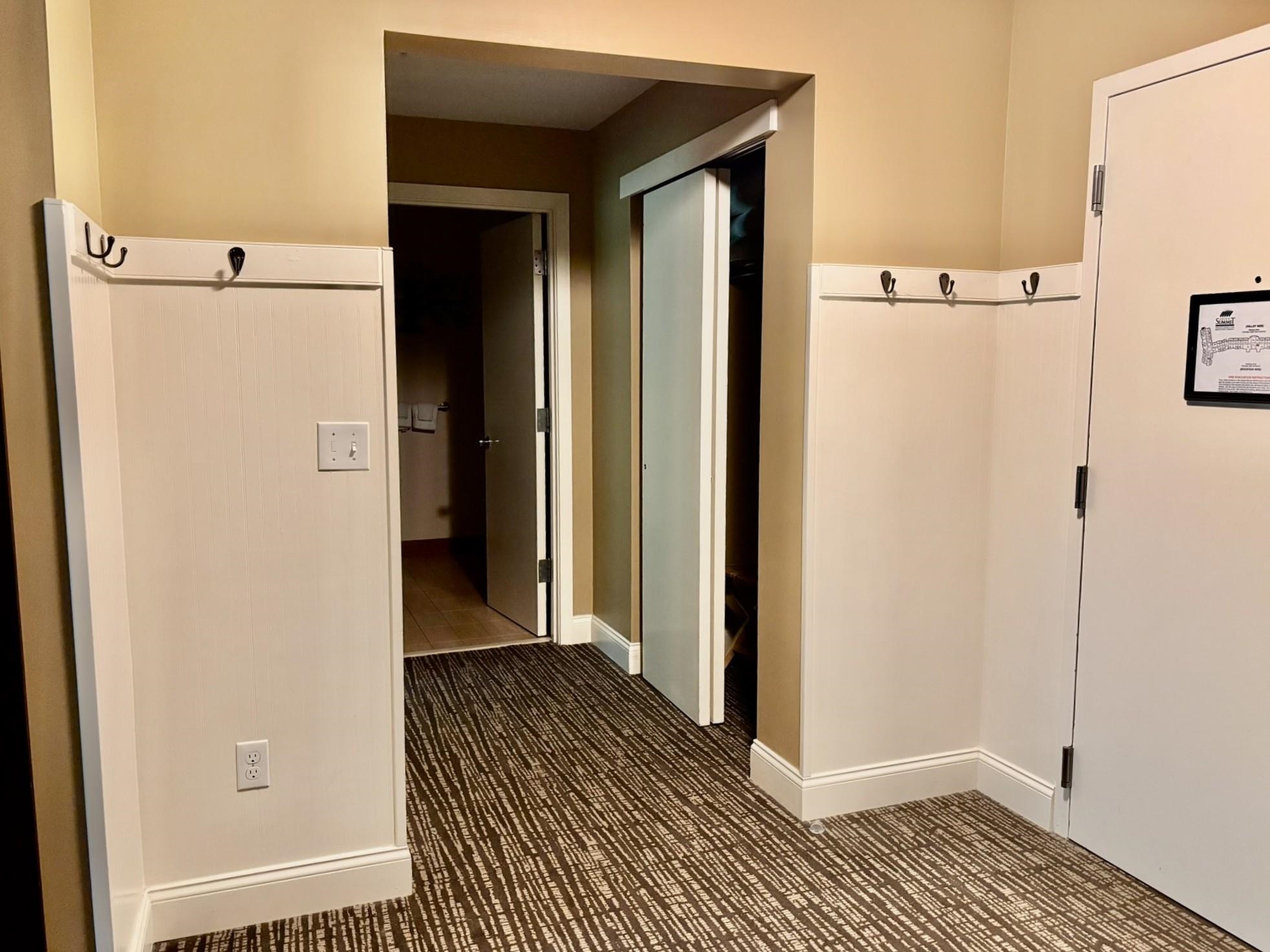 Entry Area w/ hooks for coats and closet