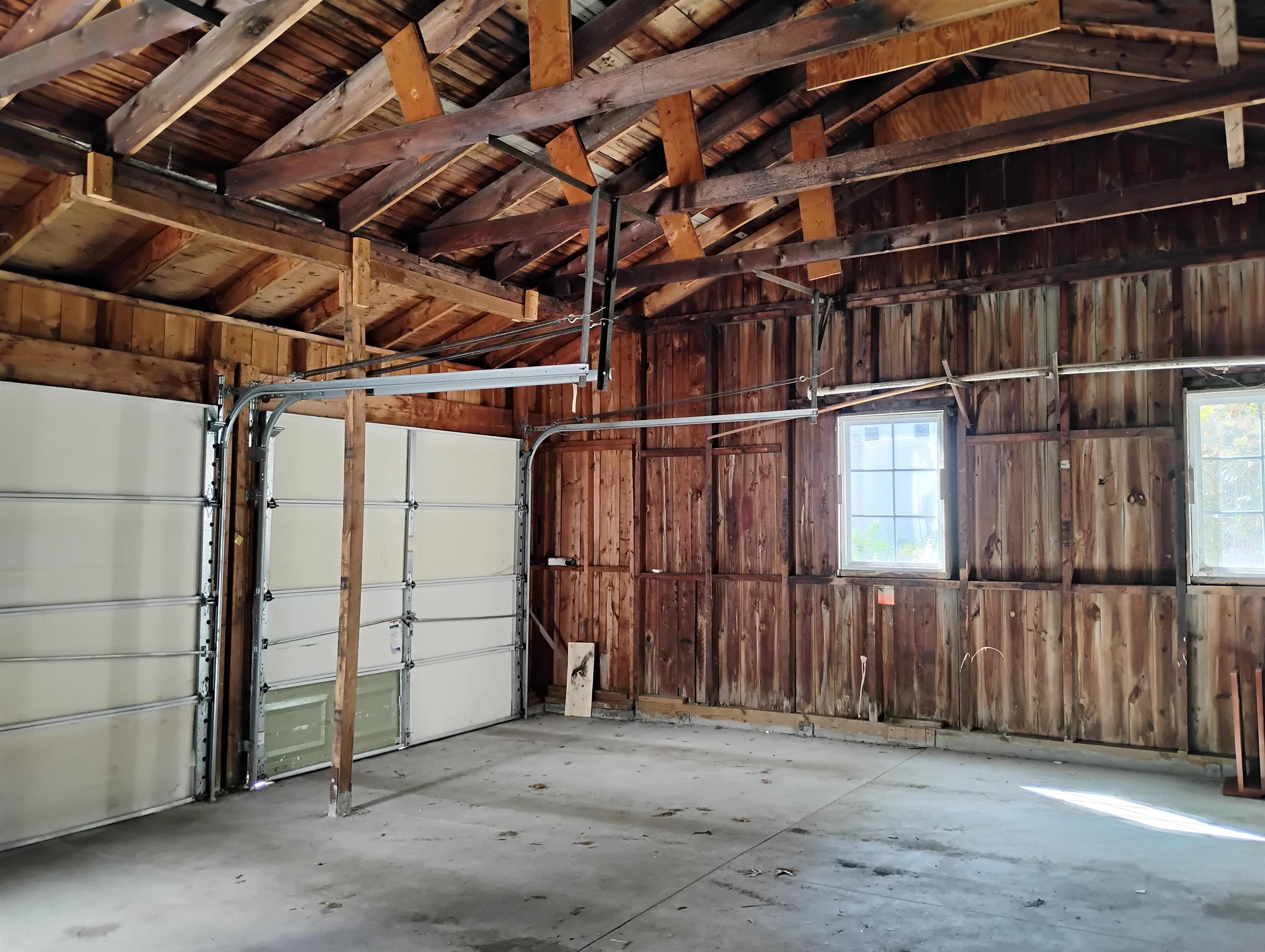 GARAGE INTERIOR W/NEW CONCRETE FLOORING