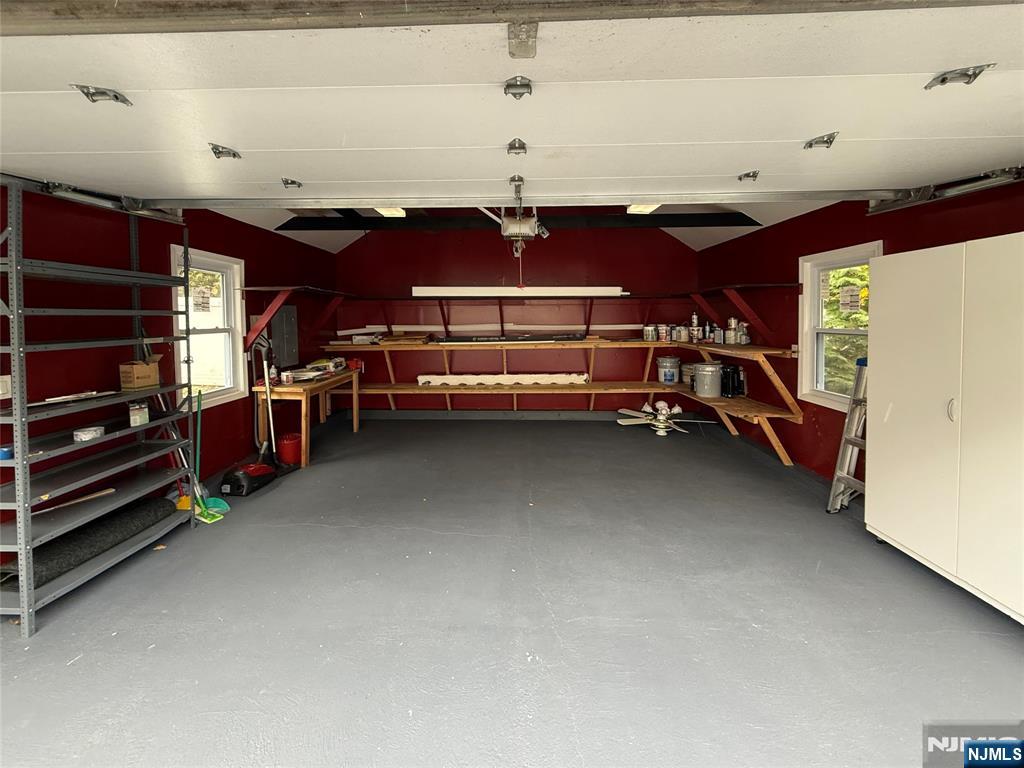 Updated Large Garage with Cabinets, Shelving & Finished Floor!