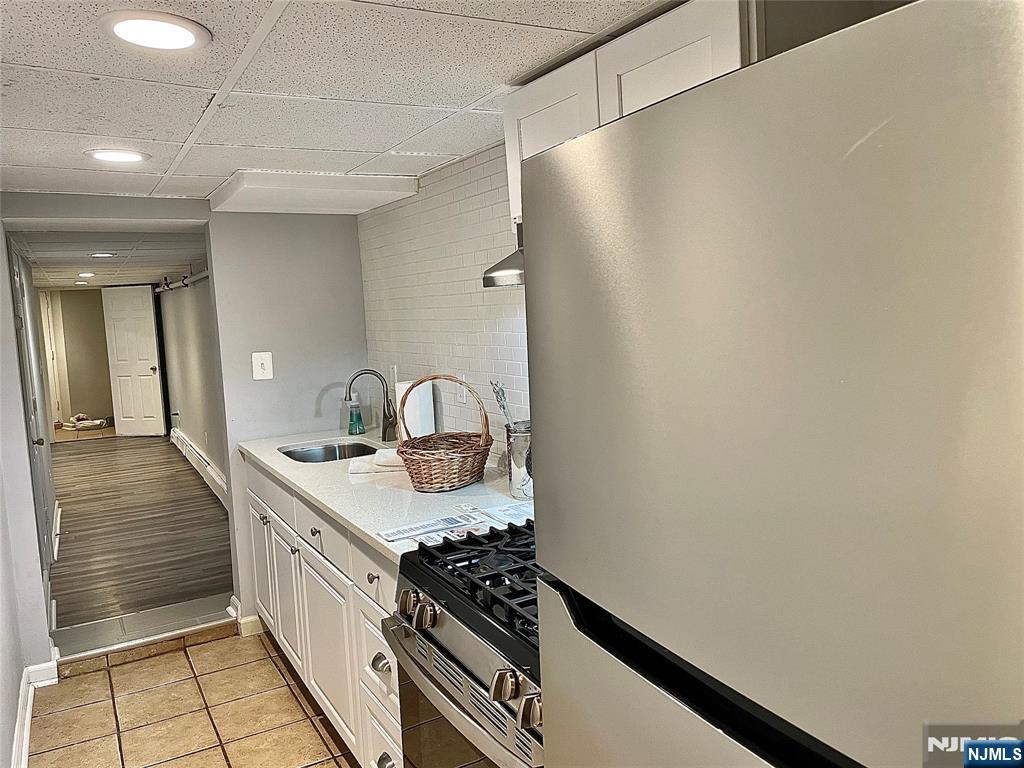 RENOVATED KITCHEN, SINK, STOVE, & REF