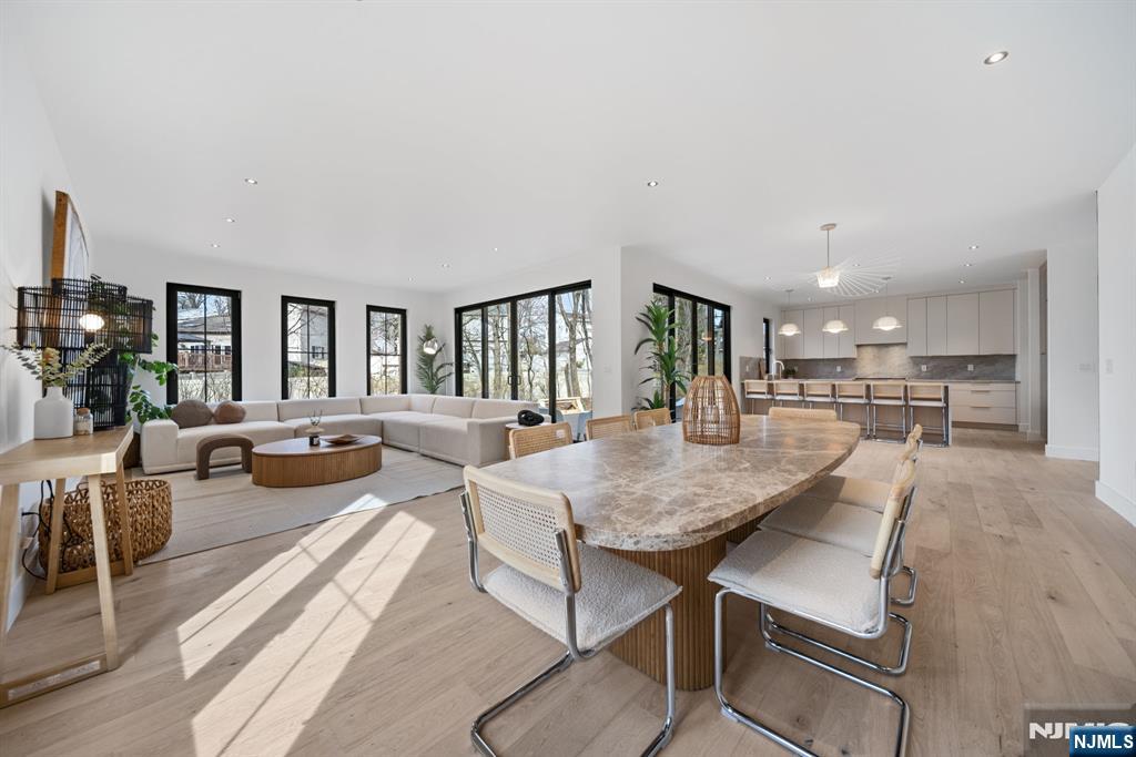 Sun drenched open floor concept living dining kitchen