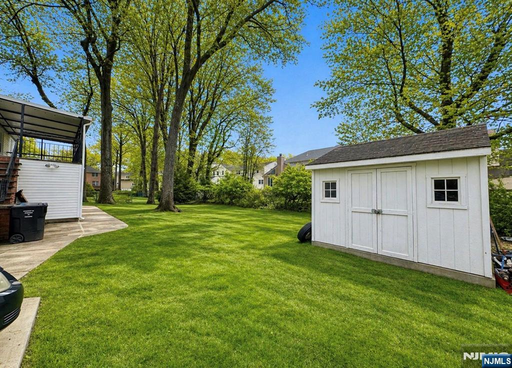 LARGE LEVEL REAR YARD WITH STORAGE SHED