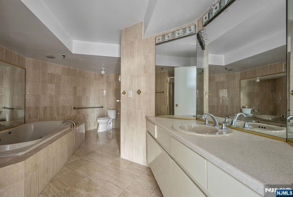 Primary bath with shower and whirlpool