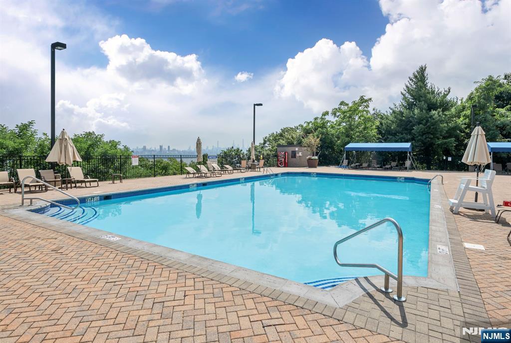 Outdoor pool overlooking the river and NYC