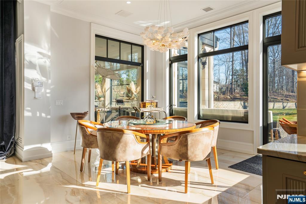 Sunny Breakfast Room w/View of Solarium, Stone Patio & Yard