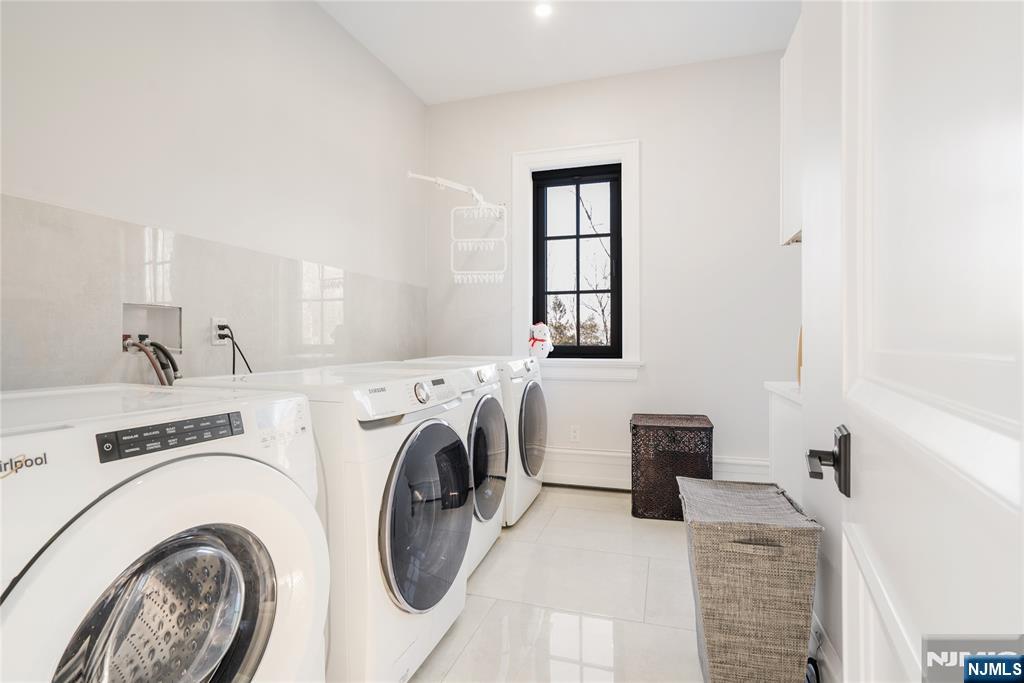 2nd Fl Laundry Multiple W/D's + Folding Table/Cabinetry