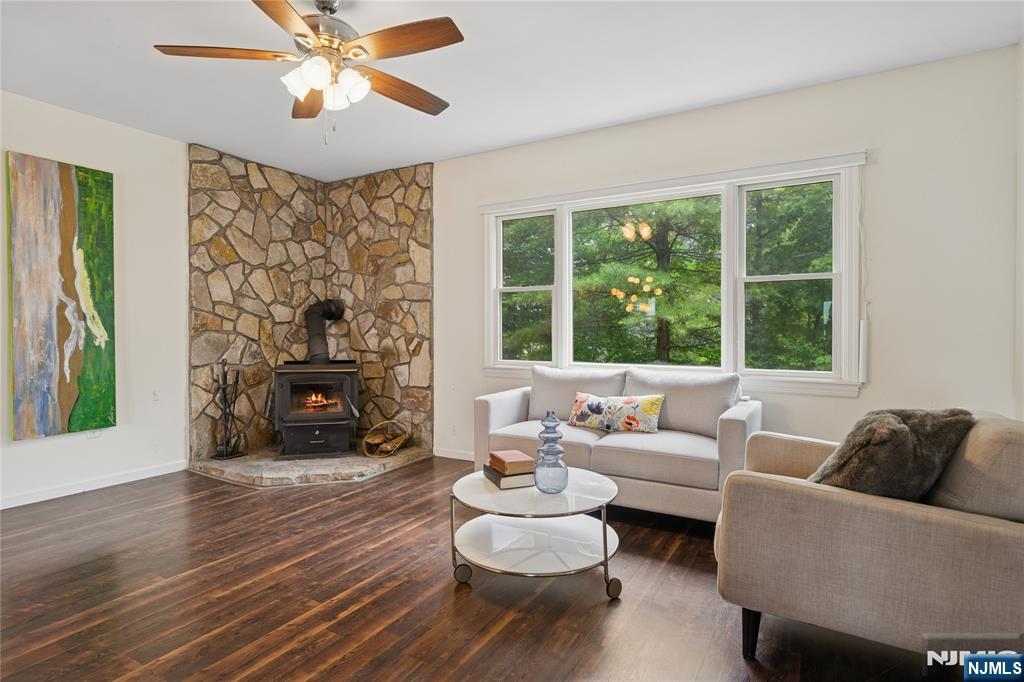 Living room with vinyl flooring and ceiling fan