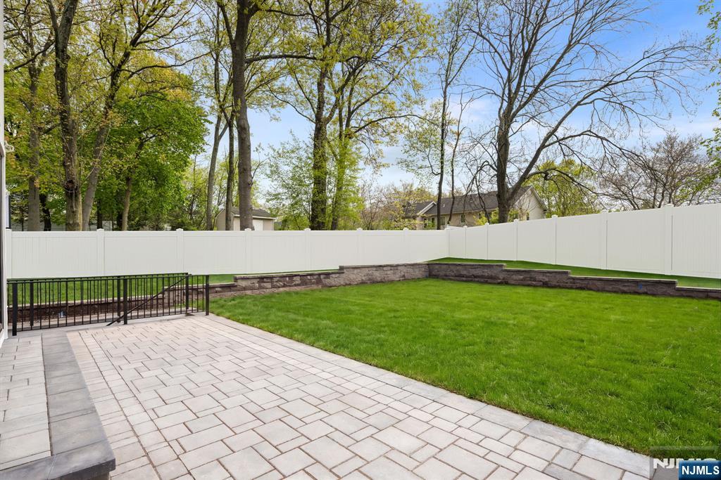 Outdoors, enjoy a private setting with future pool potential