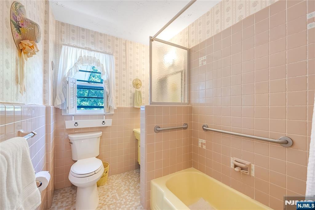 Bath with shower over tub