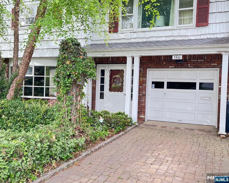 Garage with paver driveway