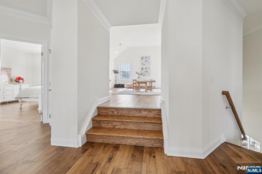 2nd floor landing with steps up to Playroom/bonus room