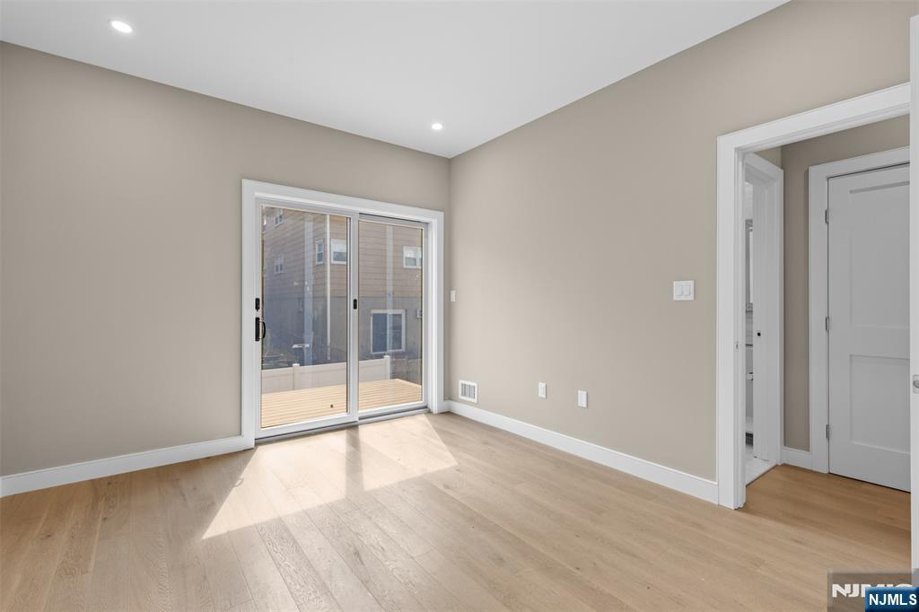 Main Level Bedroom with sliders to private deck
