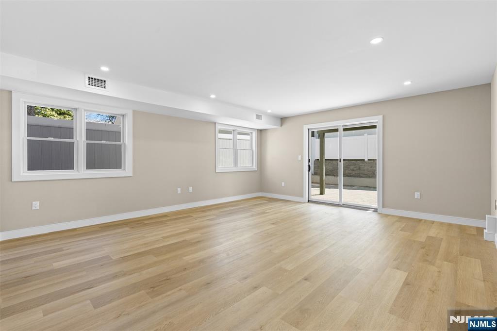 Ground Level Rec Room with sliders to yard