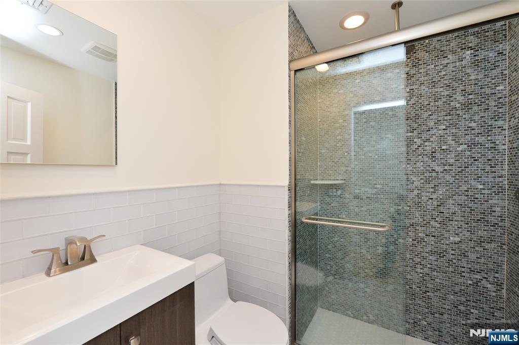 Hall full bath with stall shower.
