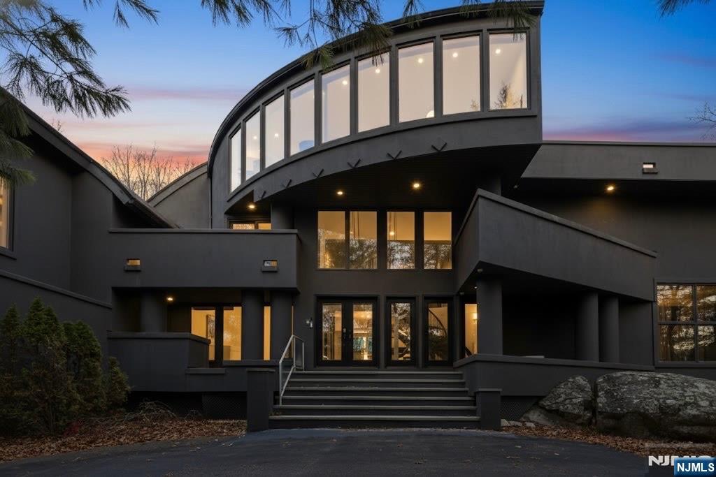 This Modern Showpiece offers Rare Design, Unparalleled Privacy & an Ambiance that is Truly Unforgettable