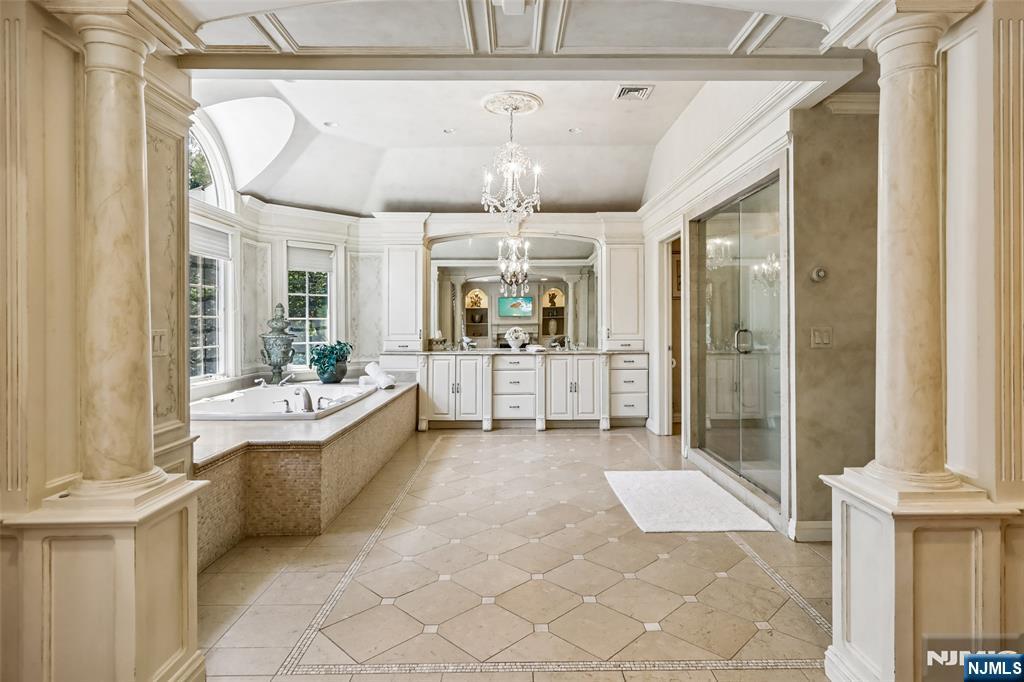 Sumptuous Primary Bath w/Double Vanity, Make-Up Counter, Oversized Shower & Jetted Tub.