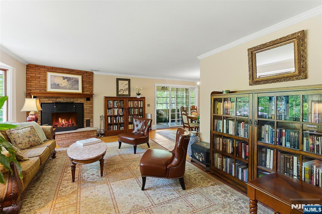 Beautiful Living Room with Bay Window, Fireplace with woodturning stove insert, hardwood floors