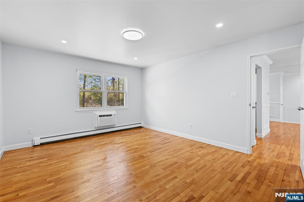 Master Bedroom with Window and Wall AC Unit