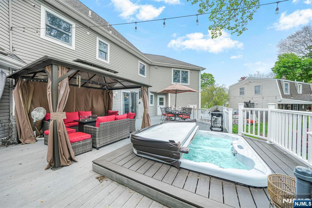 Enjoy a Trex deck with newer PVC railings, hot tub, gazebo, and 4 access points from the mudroom, kitchen, great room, and cabana room.