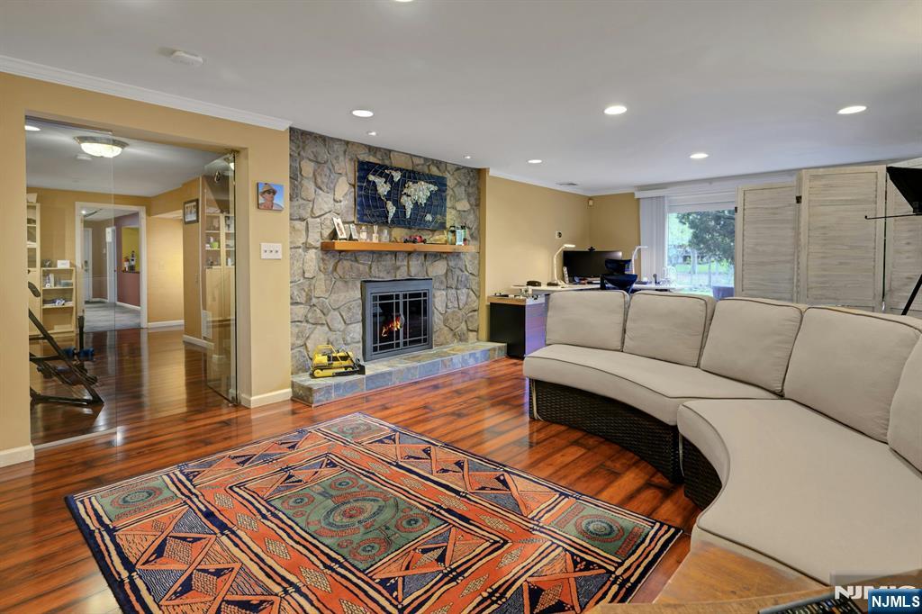 Lower Level Living Rm with stone fireplace and...
