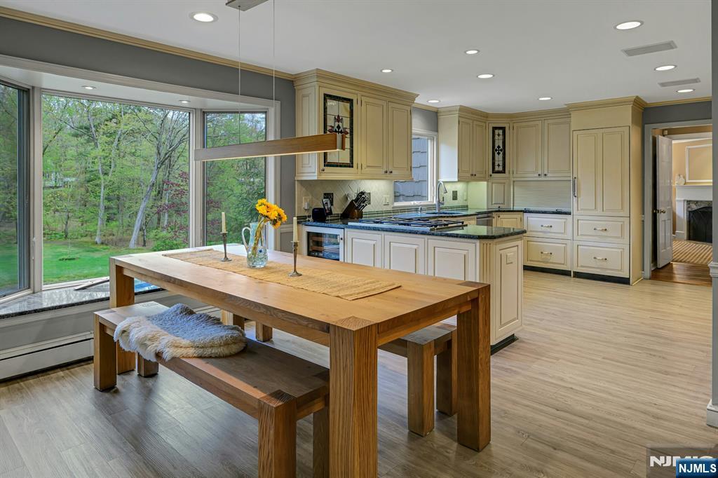 Great Breakfast Rm with huge window to enjoy rear yard oasis.