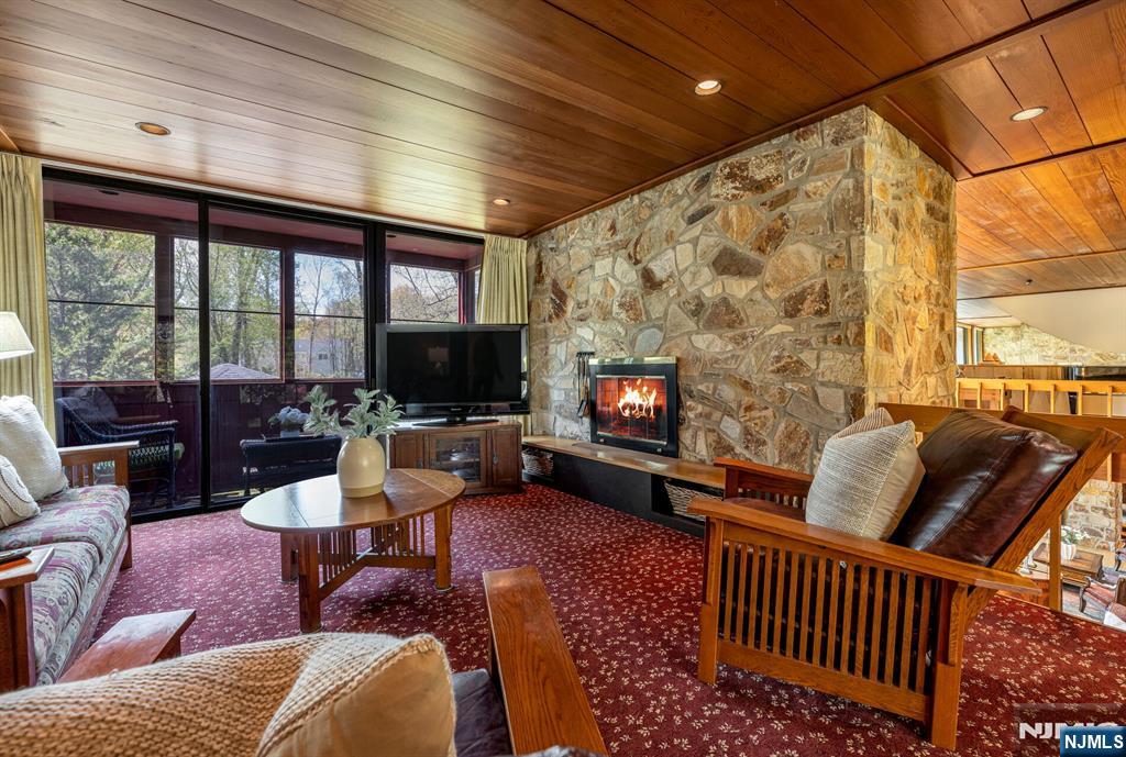 An Open Second Floor Family Room with a Peaceful Screened Balcony with Views of the Backyard