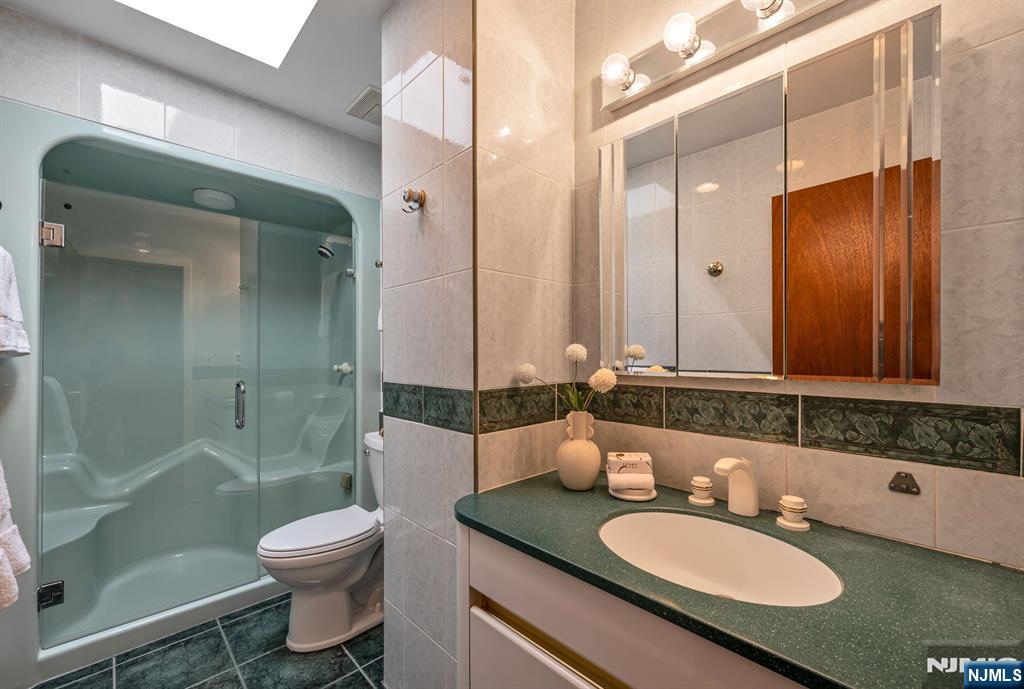 Hall Bathroom with a Skylight