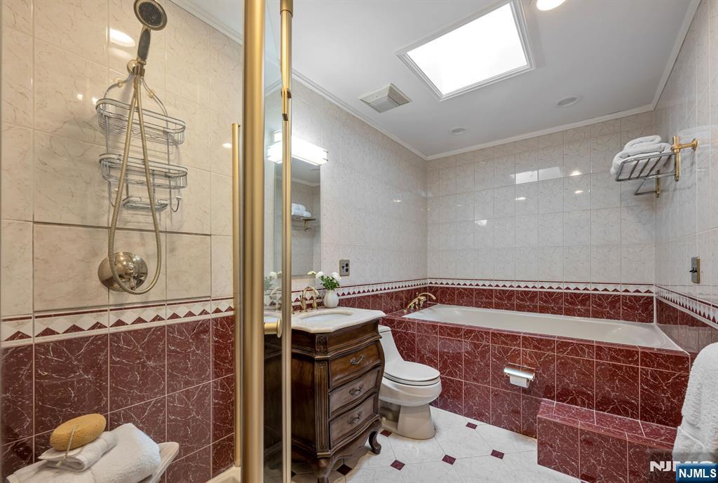 Full Bath with a Glass Enclosed Shower and Large Soaking Tub