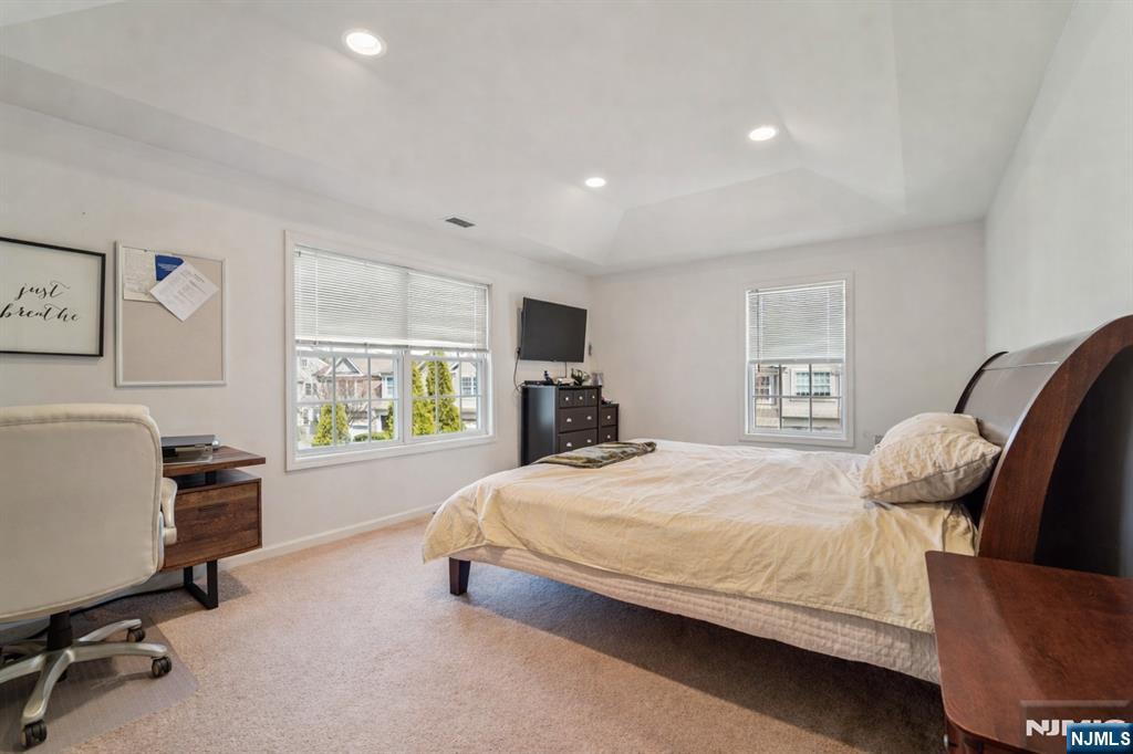 Primary BedroomThe spacious primary bedroom offers a peaceful retreat with generous closet space and a bright, inviting atmosphere.