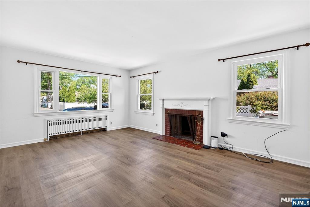 Living Room with Decorative Fireplace and Brand New Windows