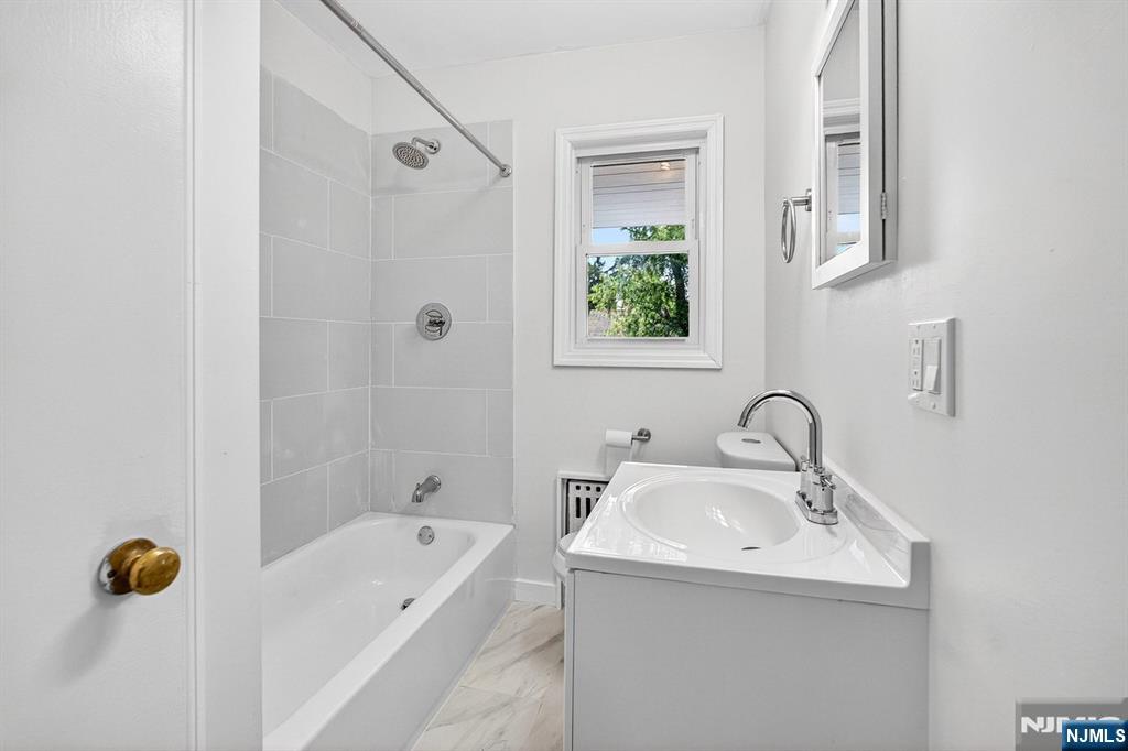 Updated Bath with New Fixtures, Flooring, Tiles & Window