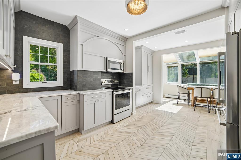 updated kitchen with ss appliances, pullout features and coffee station