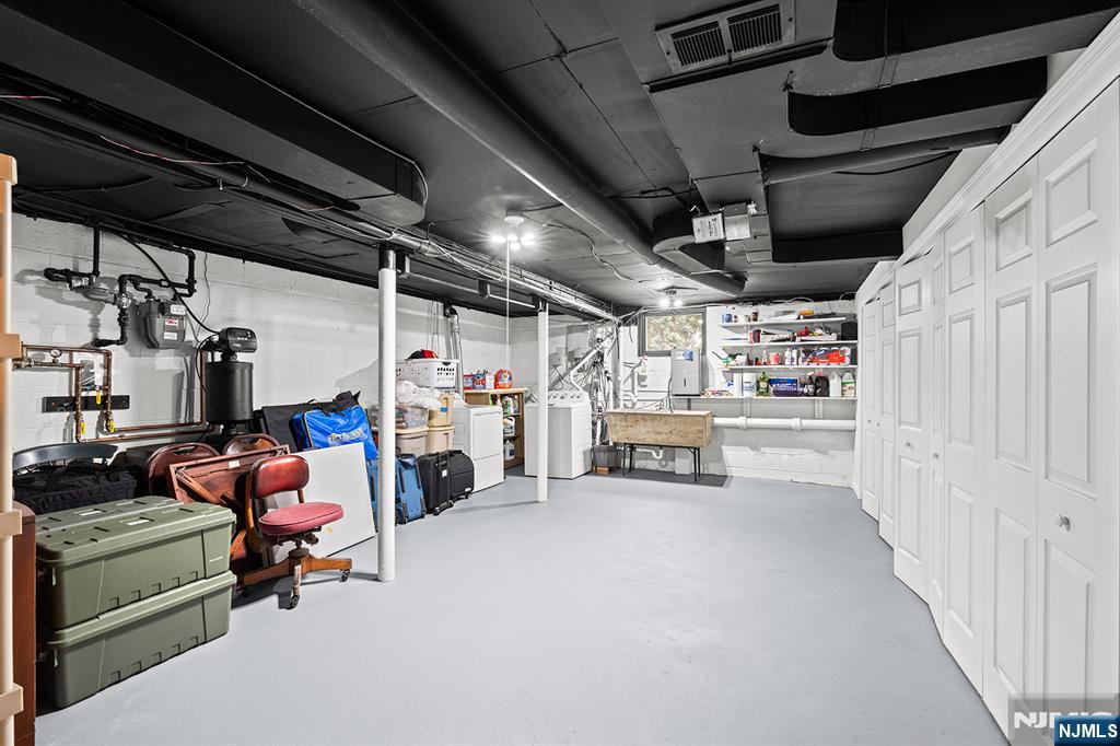 Unfinished Basement Area with Ample Storage & Closet Space