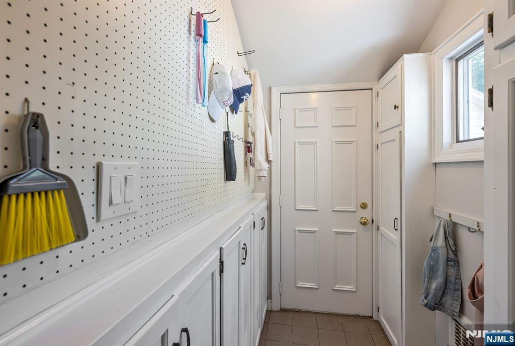 Nearby Mudroom with Built-Ins with Access to the Rear Yard