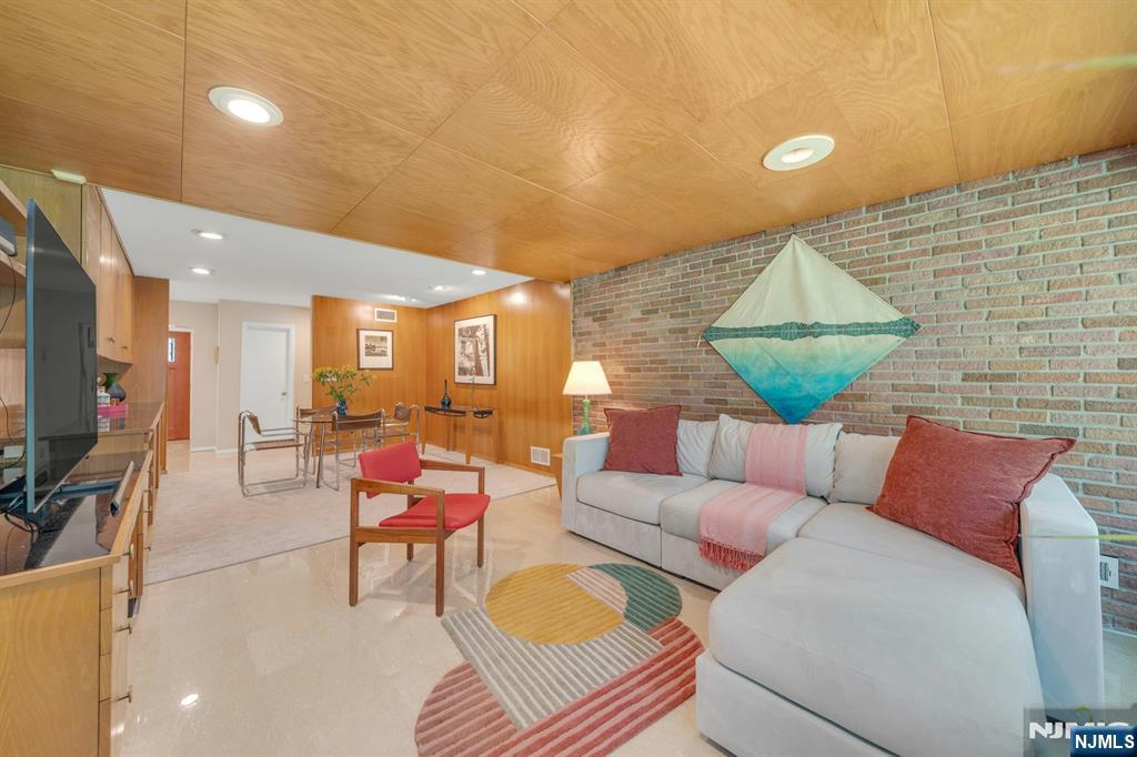 stunning blend of exposed brick and rich woodwork.