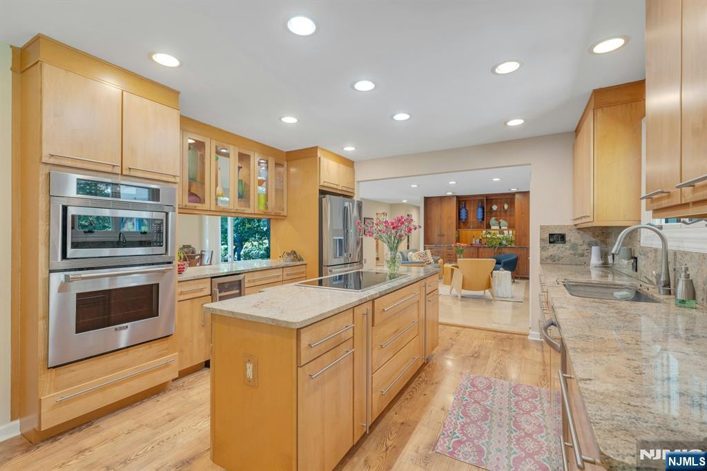 light-filled open kitchen featuring a sleek induction stove