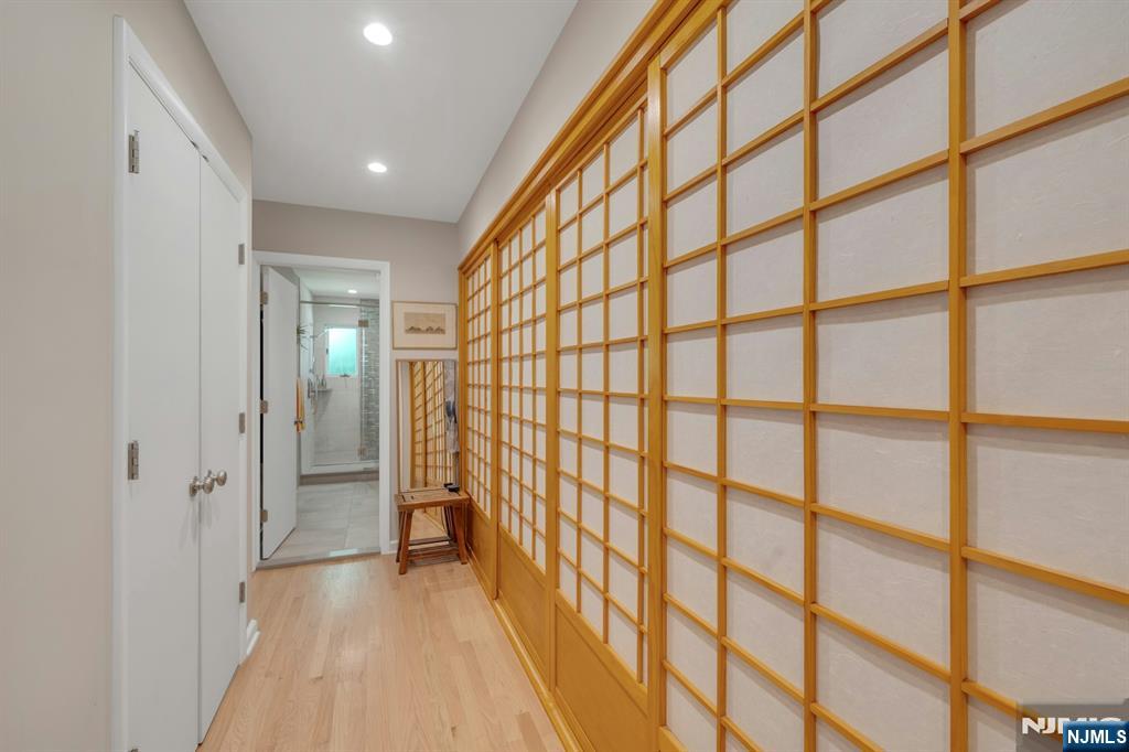custom walk through closets keeps everything organized, neatly tucked away, and out of sight.